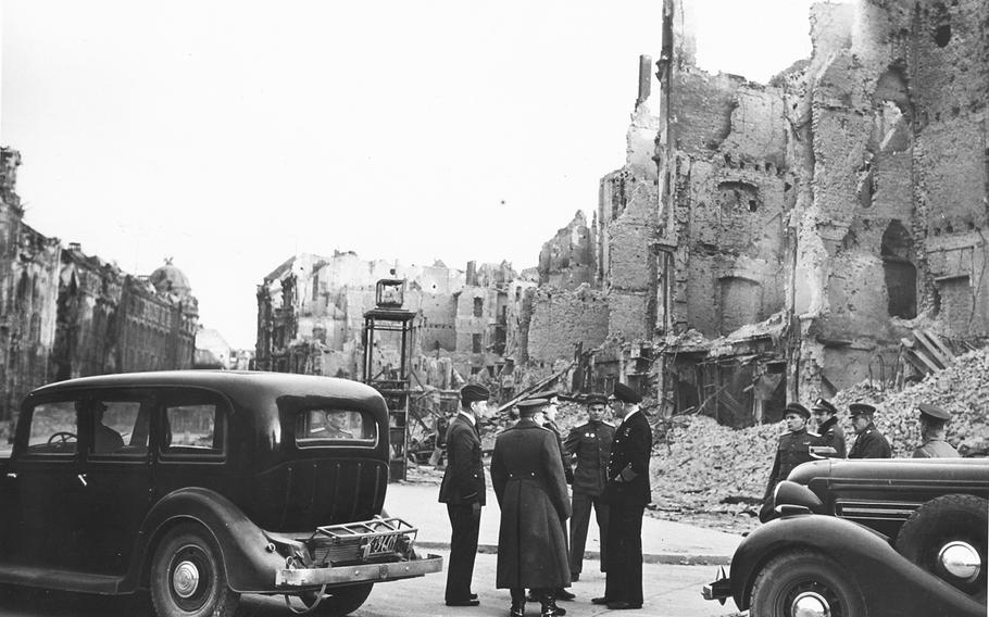 First Baron Arthur William Tedder, deputy commander Supreme Headquarters Alllied Expeditionary Forces, right, bomb damage in Berlin in May of 1945. 
