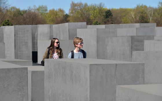 Visitors walk though the Field of Stelae, the 2711 concrete blocks that makes up most of the Memorial to the Murdered Jews of Europe in Berlin.
