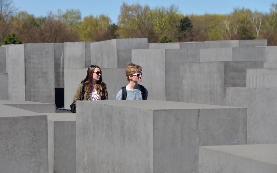 Visitors walk through the Field of Stelae, the 2711 concrete blocks that makes up most of the Memorial to the Murdered Jews of Europe in Berlin.