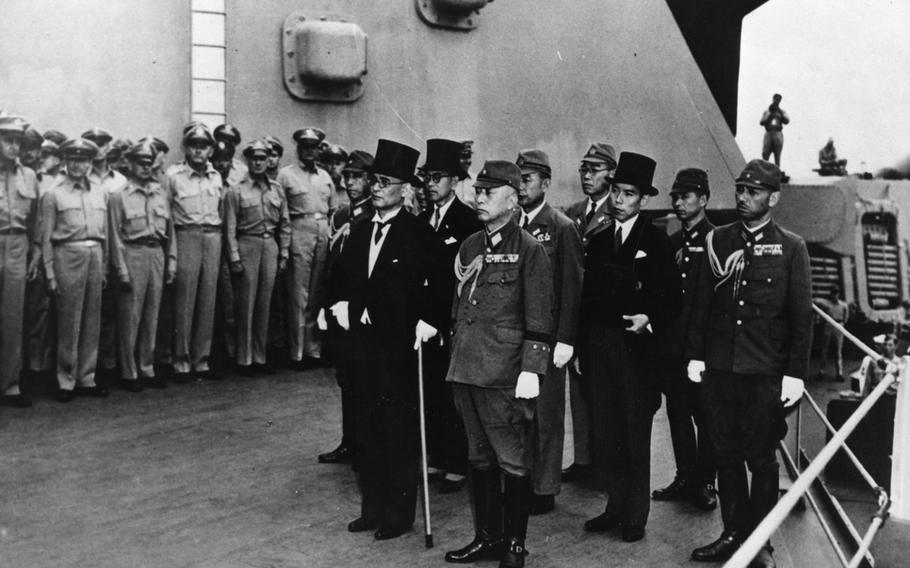 Japanese representatives arrive aboard the USS Missouri in Tokyo Bay to participate in formal surrender ceremonies on Sept. 2, 1945.