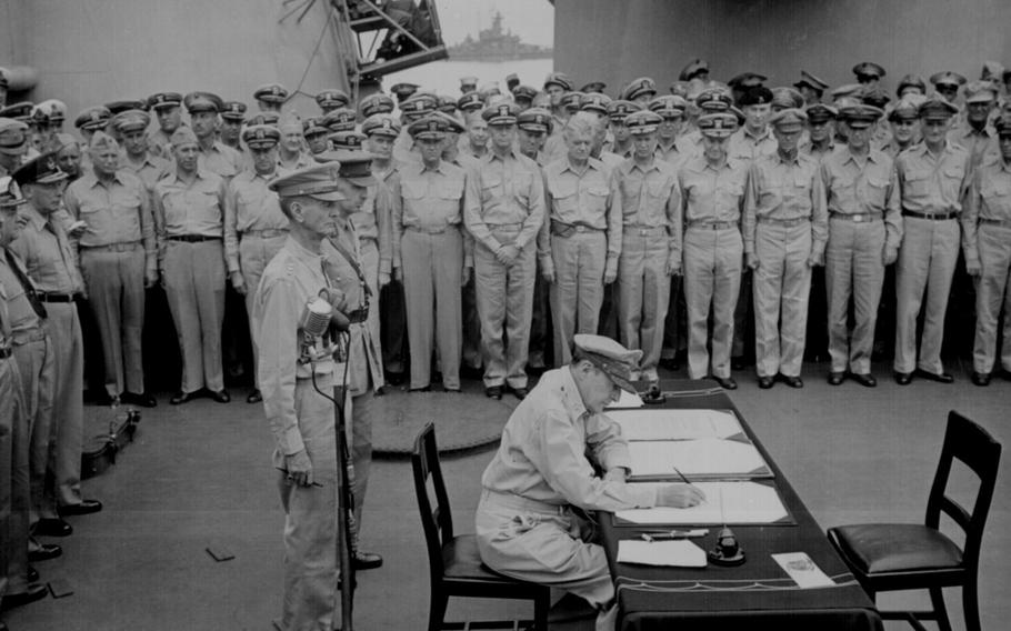 Gen. Douglas MacArthur, Supreme Allied Commander, signs the formal Japanese surrender documents aboard the USS Missouri in Tokyo Bay, Japan, on Sept. 2, 1945. 