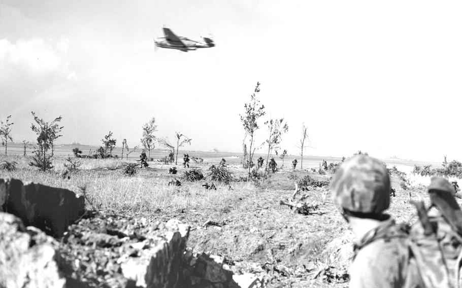 Supported from the air, Marines move inland from the Okinawa beach on April 1, 1945, the beginning of the Battle of Okinawa.