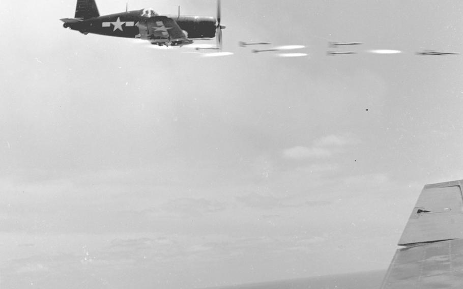 An F-4U of Marine Air Group 33 fires its rockets at as Japanese stronghold in southern Okinawa.
