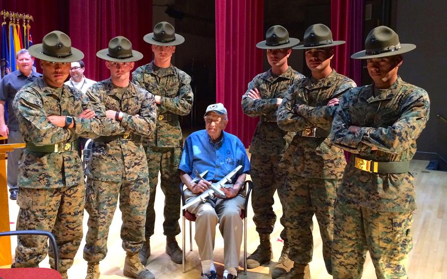 Marine drill instructors pose for a photo with Raymond ''Speedy'' Biel, who served as a B-29 co-pilot during World War II. Biel spoke to the Marines about his experiences, including participating in both missions to drop atomic bombs on Japan. Biel said the mission was so secret that he didn't know about the atomic bomb until after the first mission was over, but said the men in his unit were all happy when they heard about it, because they ''knew the war was going to end.''