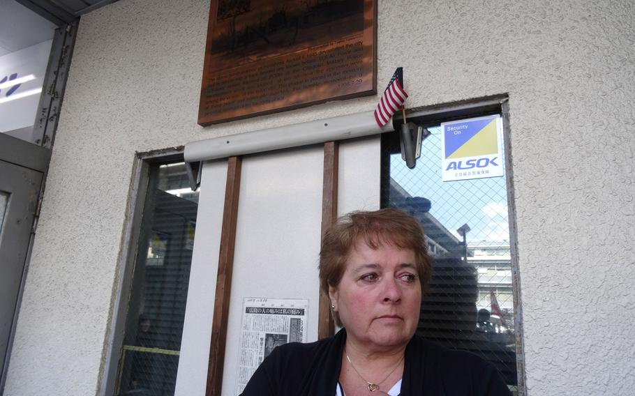 Susan Archinski, 55, of Massachusetts, stands at the site where a former POW detention facility was located in Hiroshima, Japan. On this spot, her uncle, Normand Brissette, and 11 U.S. servicemembers were exposed radiation from the atomic bomb dropped on the city in 1945.