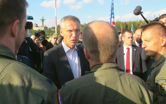 NATO Secretary-General Jens Stoltenberg meets with U.S. Air Force personnel at Lask Air Base in Poland in October 2014.