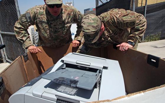 Soldiers with the 82nd Airborne Division pack electronics at Camp Mike Spann, near Mazar-e-Sharif, in northern Afghanistan. Coalition forces turned over the base, part of a larger training center, to Afghan control at a ceremony Sunday, April 27, 2014. 

Heath Druzin/Stars and Stripes
