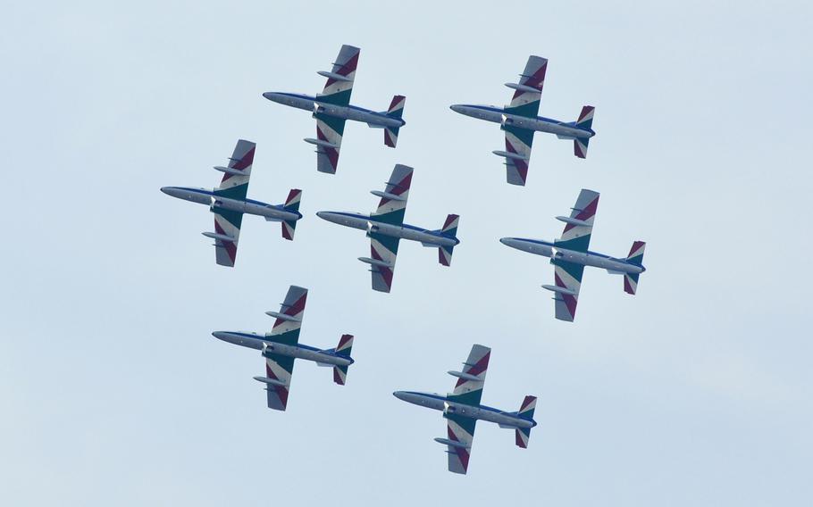 Seven members of Italy's national air acrobatics team, Frecce Tricolori, fly over Aviano Air Base during a demonstration on April 4, 2014.