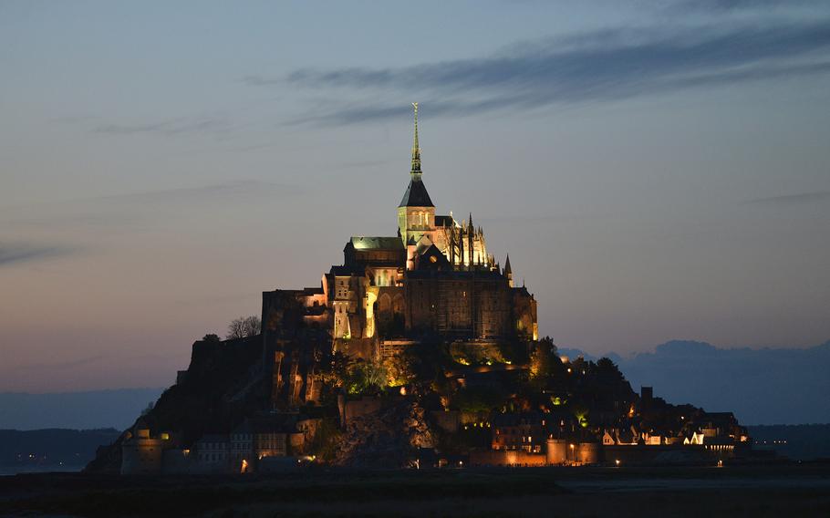 Mont-St-Michel at dusk, May 7, 2014. The first church built on this small island off the French coast was constructed in 709. Later, an abbey church was built on the top of the rock and fortifications were added. Today it is one of France's top tourist attractions.