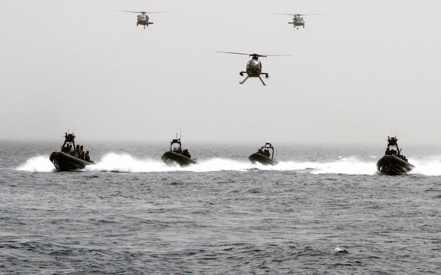 Multinational special forces assault a target on shore during a demonstration to the media and civilian observers at the Eager Lion exercise in Aqaba, Jordan, June 5, 2014.