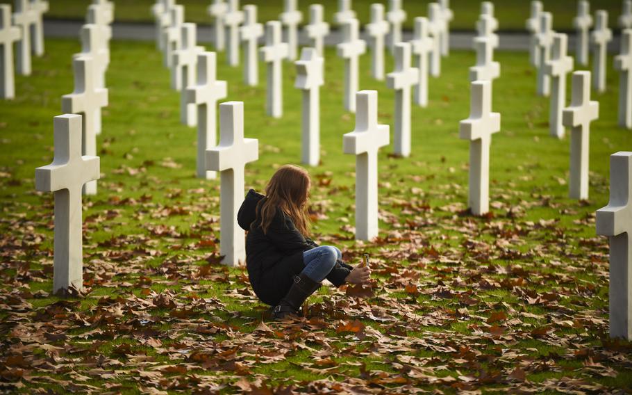 Megan Stretch takes a photograph at Lorraine American Cemetery in St.-Avold, France, on Veterans Day, Nov. 11, 2014.