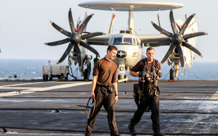 Flight deck personnel prepare for flight operations on Nov. 28, 2014, aboard the USS Carl Vinson in the Persian Gulf.