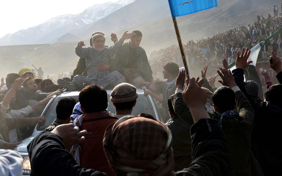 Afghan presidential candidate Abdullah Abdullah greets supporters at a rally in Panjshir province. While he has faced accusations of playing up ethnic divides, Abdullah says ethnicity is fading as an issue in Afghan politics.