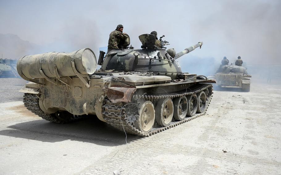 Afghan soldiers conduct an exercise in the last remaining Soviet-era tanks in the Afghan army. Despite their age, the tanks are deployed in small numbers against Taliban insurgents.