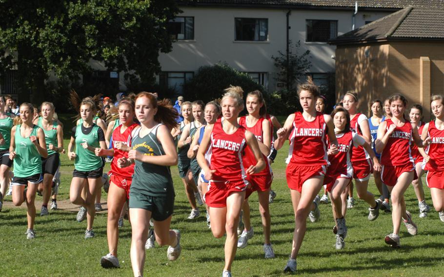 Alconbury cross country runner Imogen Weaver and Lakenheath's Elizabeth Doe lead the pack during the varsity girls cross country meet Saturday at RAF Lakenheath. Doe went on to win the race with a time of 20 minutes, 17 seconds.
