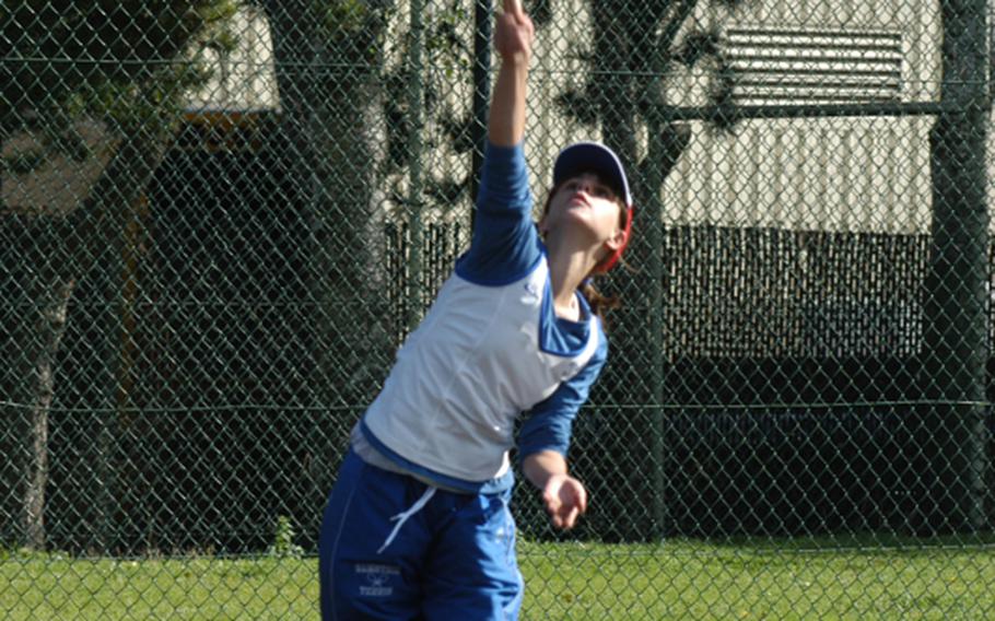 Ramstein's Meghan Augsburger serves the ball during her tennis match Saturday at RAF Lakenheath, England.