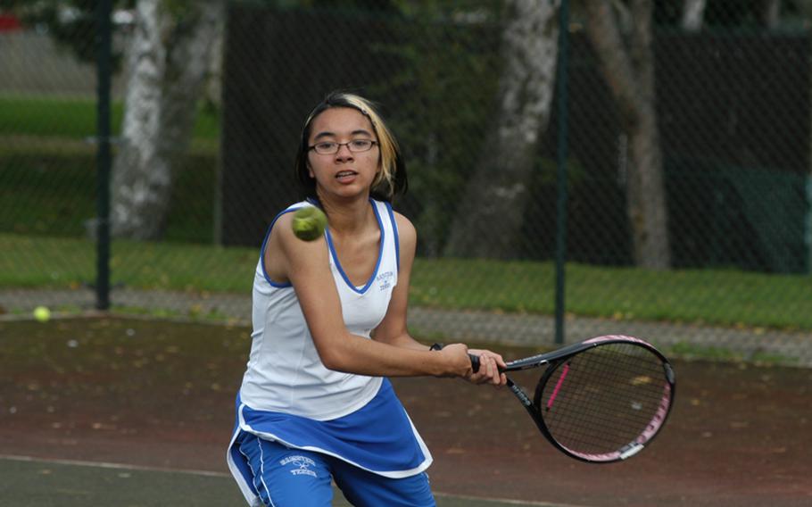 Ramstein tennis player Michaela Corral backhands a return shot during a match Saturday at RAF Lakenheath, England.