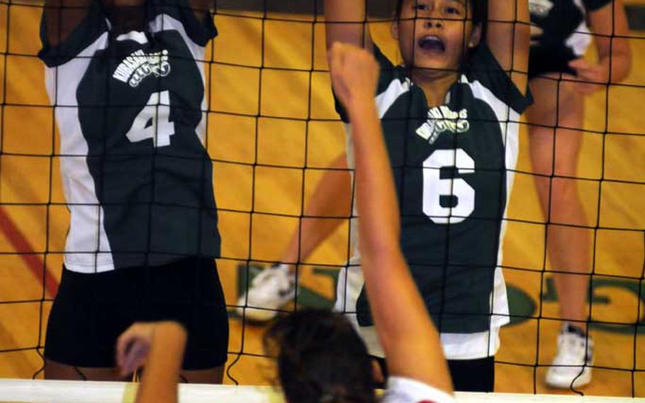 Charissa Kellond (7) of Okinawa Christian International tries to hit the ball through the block of Kaiya Wallace (4) and Christelle Abello (6) of Kubasaki during Tuesday's Okinawa Activities Council girls volleyball match at Dragons' Den, Kubasaki High School, Camp Foster, Okinawa. The host Dragons beat the Crusaders 24-26, 31-29, 27-25, 25-23.