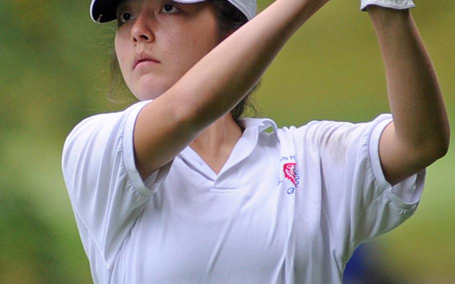 Ramstein's Elizabeth Ward follows the flight of the ball after teeing off Woodlawn's 11th hole on Thursday in Ramstein. Ward won the meet, the last before next week's DODDS-Europe championships, with a 33 under modified Stableford scoring.