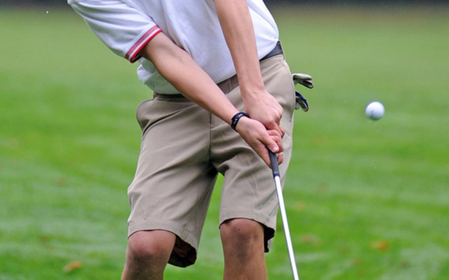 Kaiserslautern's Caleb Hayes chips a shot to the green during a high school golf match hosted by K-Town at Ramstein's Woodlawn golf course, on Thursday. He finished fourth in the boys individual competition.
