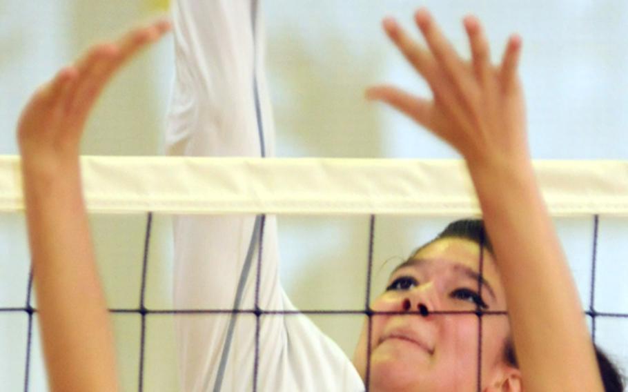 Daegu American senior Kristina Bergman goes up for the kill at the net against the Kadena defense during Friday's match in the first Kadena Invitational Girls Volleyball Tournament at Panther Pit, Kadena High School, Kadena Air Base, Okinawa. Daegu, the defending Far East Division II Tournament champion, won 25-12, 25-11.