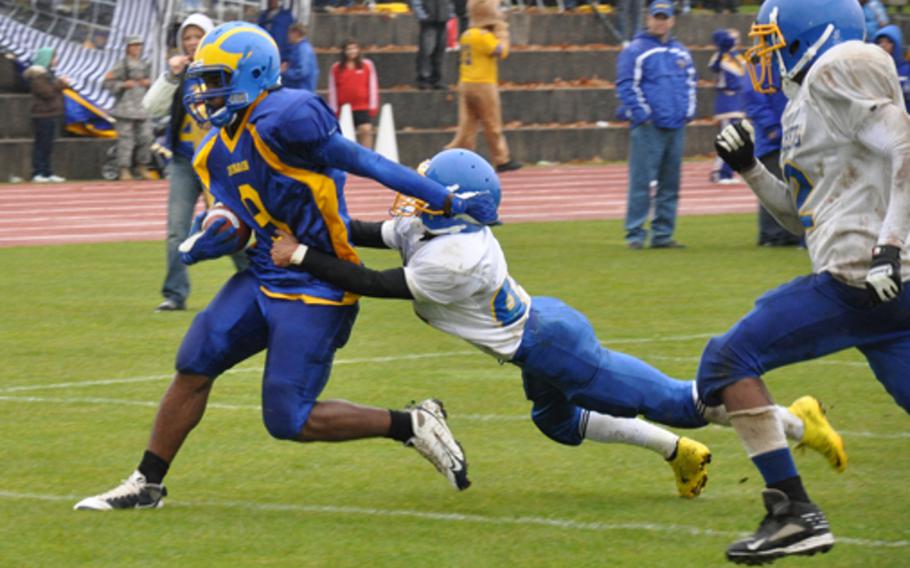 Ansbach sophomore Johnny Bunch tries to break free of a  Bamberg tackler Saturday in Ansbach's 24-12 victory over the visiting Barons.