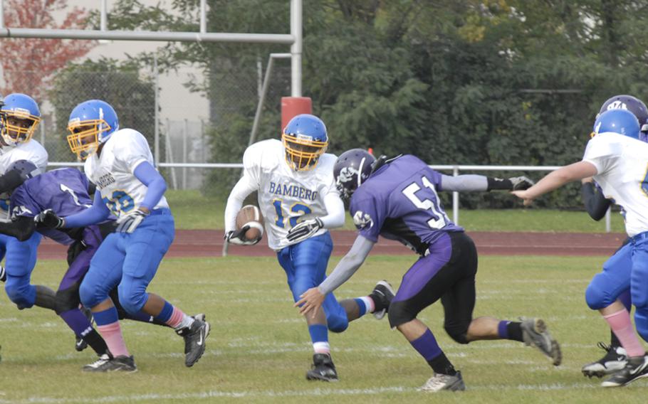 Bamberg's Brian Hargraves tries to elude Mannheim defender Sean Knight during Saturday's D-II quarterfinal playoff game.  The Bison won, 51-20.
