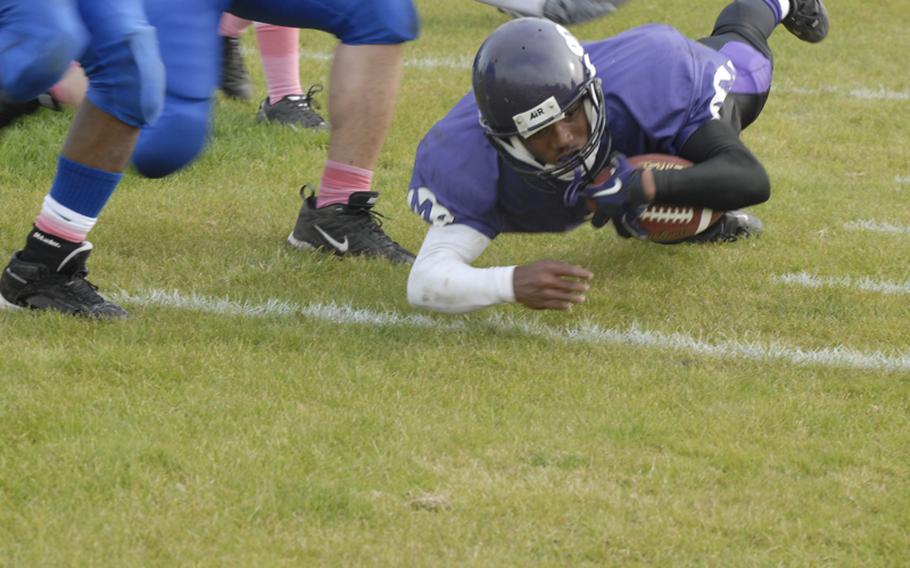 Mannheim's Aaron Garrison reaches for the goal line during Saturday's D-II playoff game against Bamberg.  Garrison finished with five touchdowns on the day as Mannheim won, 51-20.
