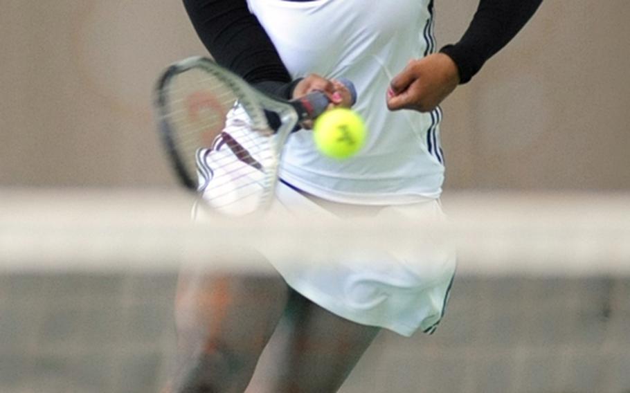 Tekeha Turner of Vilseck rushes to the net to return a Mehgan Eaker shot. Kaiserslautern's Eaker won the first-round match 6-1, 6-1