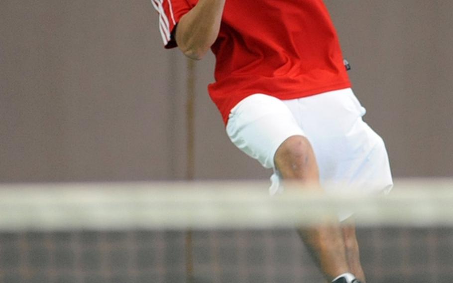 Kaiserslautern's Christopher Jimenez powers the ball back to Alconbury's Ronald Behr in their first-round match at the DODDS-Europe tennis tournament  in Wiesbaden, on Thursday. Jimenez won 6-4, 4-6, 6-2.