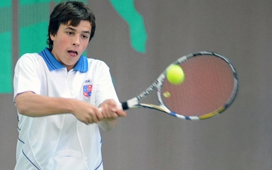 Giovanni Giorcelli of Milan returns a ball to Ryan Bottesini of Brussels during their match at the  DODDS-Europe tennis championship tournament. Giorcelli lost the first-round match 4-6, 2-6.