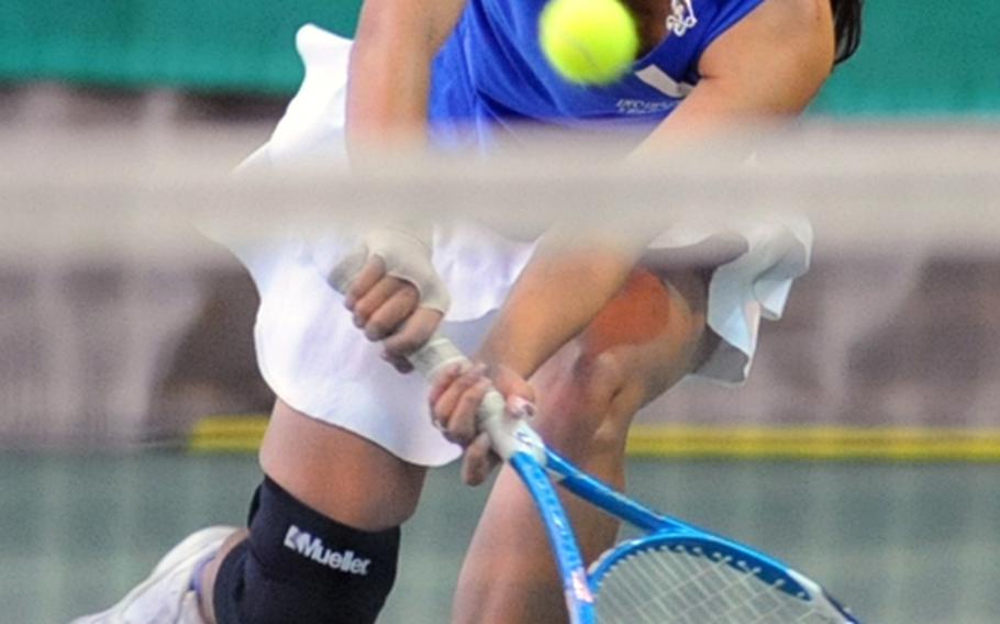 Incirlik's Adriana Thompson rushes to the net to return a shot from Wiesbaden's Kelsey Smith during the first round of the DODDS-Europe tennis championship tournament. Despite her efforts, she lost the match 1-6, 1-6.