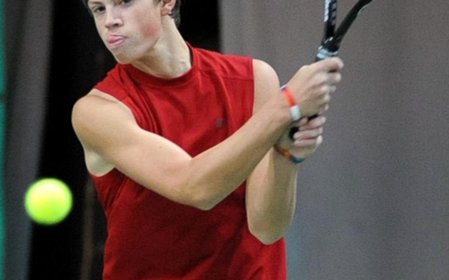 Tyler Jakobs sends a powerful shot across the net in his 1-6, 4-6 loss to Patch's Jon Lightner during the first round of the  DODDS-Europe tennis championship tournament.