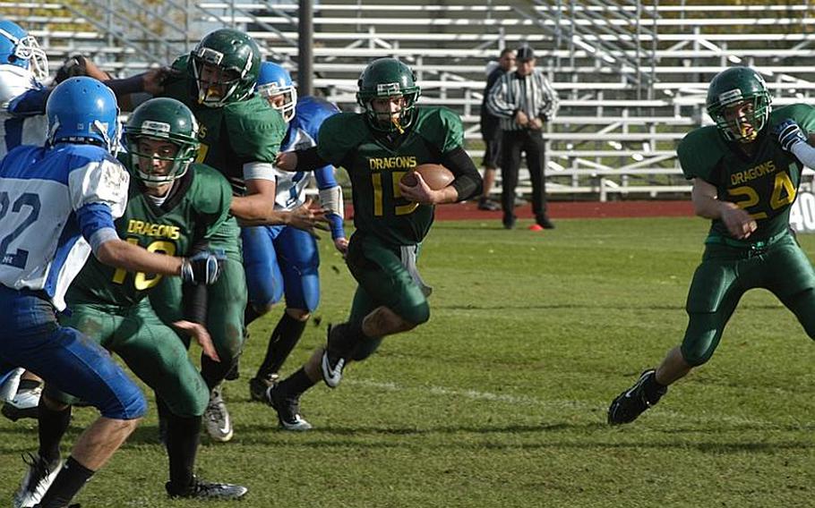 Alconbury Dragon quarterback Jeff Black follows his blockers for additional yardage Saturday during a 34-14 victory over the Rota Admirals in a Division III playoff game.