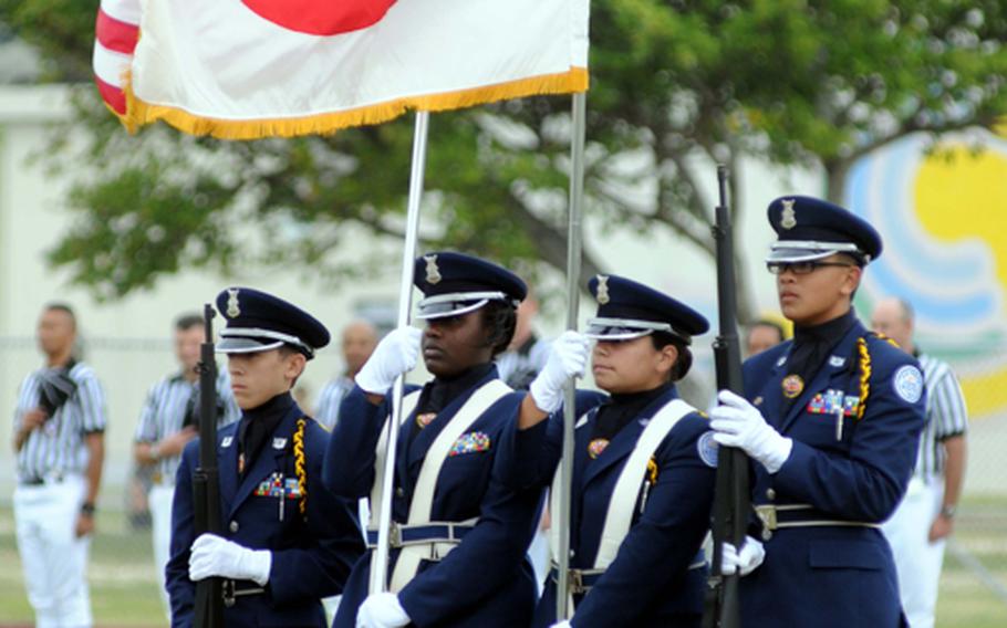 Kadena High School's junior Reserve Officer Training Corps color guard posts the colors prior to Friday's Far East High School Division I football championship game at Mike Petty Stadium, Kubasaki High School, Camp Foster, Kadena routed Yokota, 50-23, for its second straight title and third in four years. 
