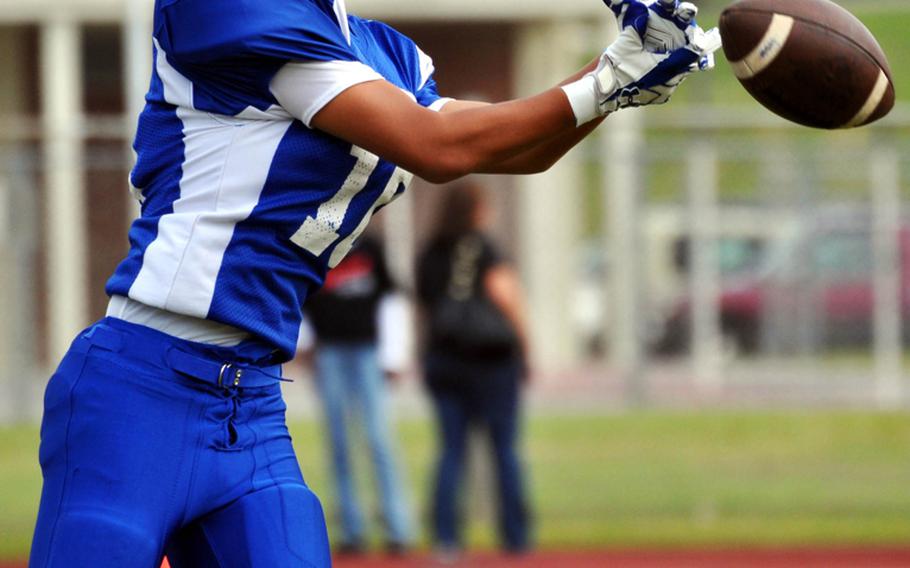 When it rains, it pours. Yokota Panthers receiver Christian Nemoca has a pass slip through his fingers against the Kadena Panthers during Friday's Far East Division I football championship game at Mike Petty Stadium, Kubasaki High School, Camp Foster, Okinawa. Kadena routed Yokota, 50-23, winning its second straight Division I title and third in four years.