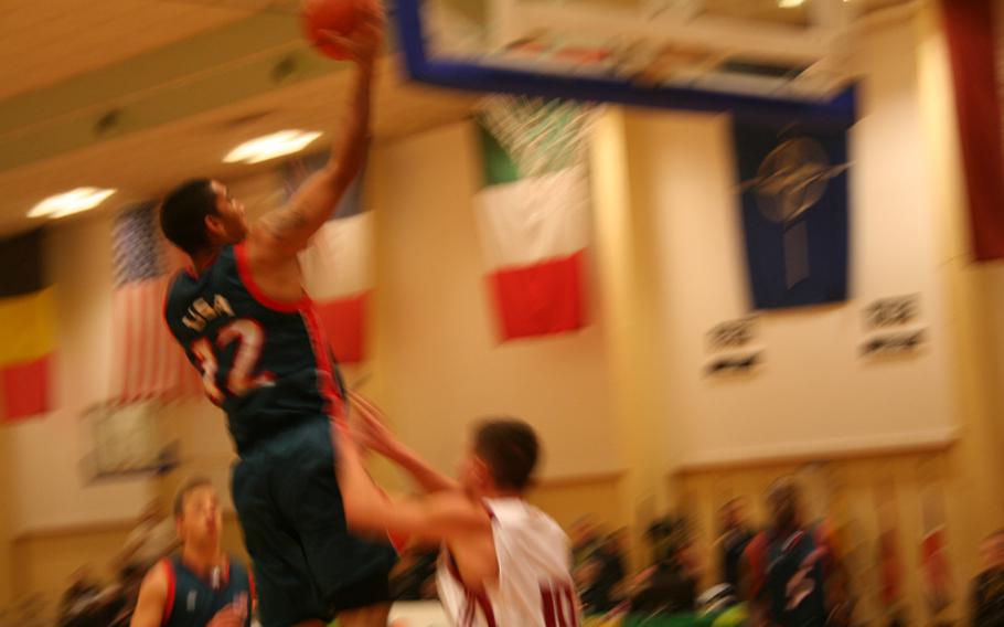 U.S. 2nd Lt. Kenneth Brewer goes up for two points during the Americans' 83-70 victory over Latvia on Friday in the SHAPE International Basketball Tournament. The U.S. was set to play Lithuania on Saturday night in the championship.