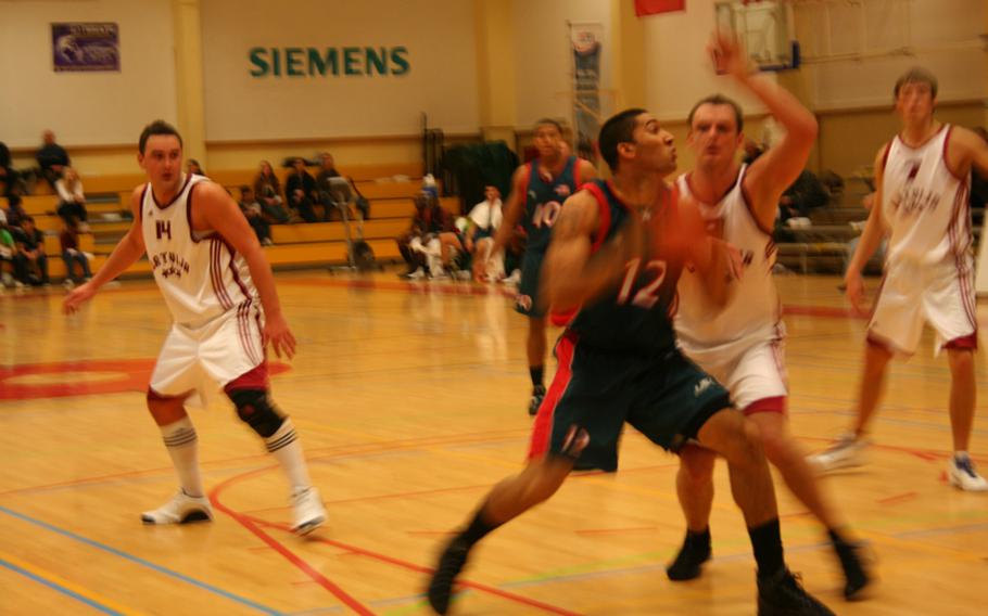 U.S. 2nd Lt. Kenneth Brewer drives toward the basket Friday during the Americans' 83-70 victory over Latvia in the SHAPE International Basketball Tournament. The U.S. was set to play Lithuania on Saturday night in the championship.