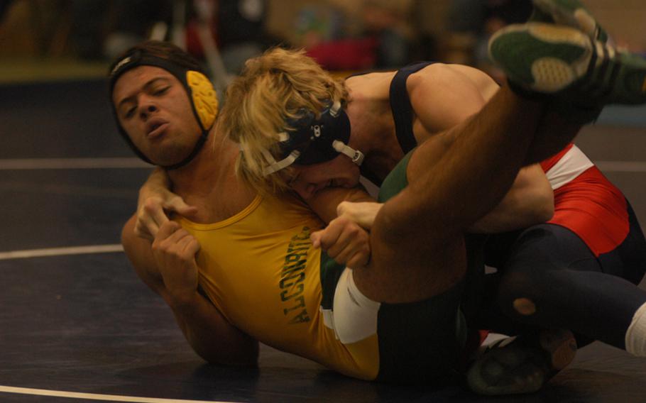 Lakenheath’s Devon Parrish and Alconbury’s Frankie Goines wrestle for position Saturday.