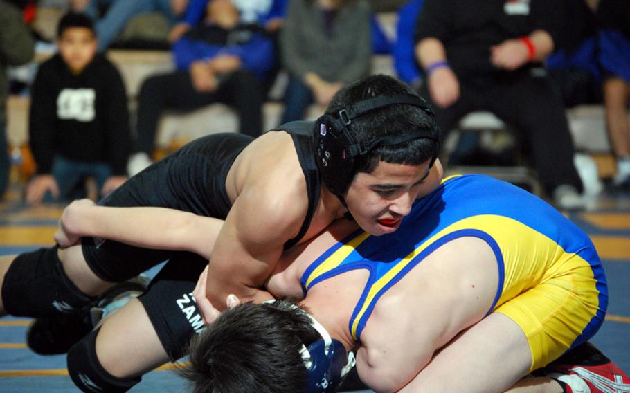 Zama American's Eric Otero seizes the advantage early against Kaimi Miyakawa of St. Mary's International during Saturday's 101-pound championship bout in the 38th Kanto Plain Association of Secondary Schools Wrestling Tournament at Yokota High School,, Japan. Otero pinned Miyakawa in 4 minutes, 23 seconds.