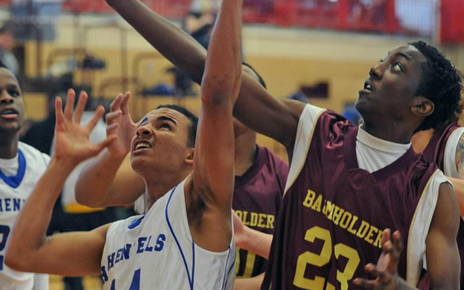 Xavier Davis of Hohenfels and Baumholder's Makel Farmer fight for a rebound in a Division II game at the DODDS Europe basketball finals in Mannheim. Hohenfels won, 68-55.
