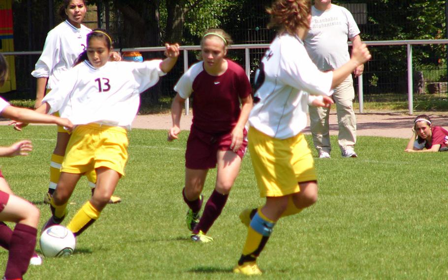 Patch’s Amber Garcia pushes the ball upfield past Vilseck’s Malia Carson to an open Emma Murray during Patch’s 2-0 victory Friday at Stuttgart, Germany.