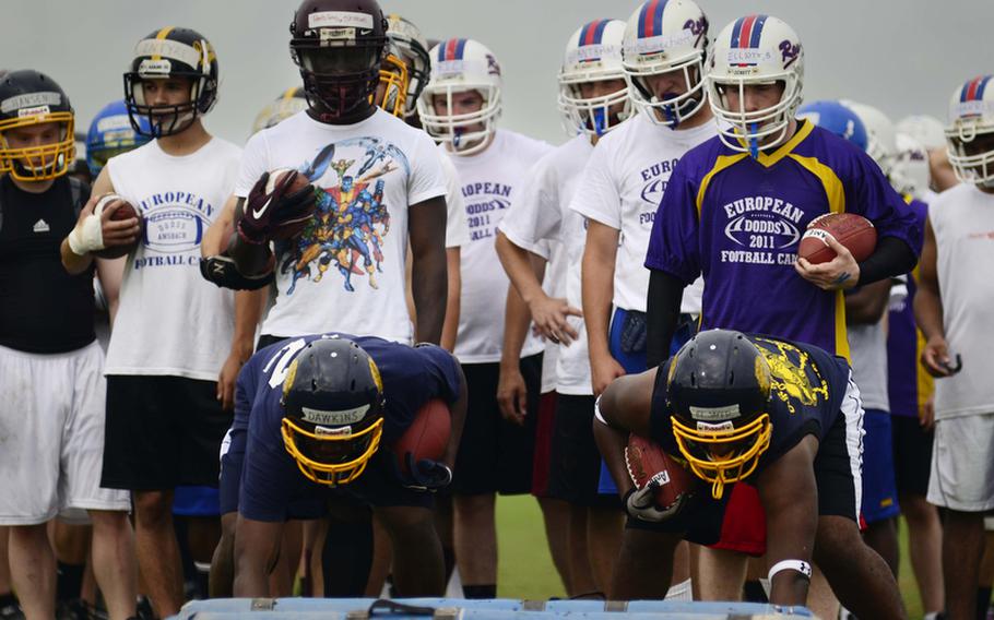 Running backs line up to do "bag drills" to improve footwork at this year's DODDS-Europe football camp in Ansbach, Germany. More than 350 football players from eight American high schools and five local national teams are participating in the annual preseason camp that ends Wednesday.