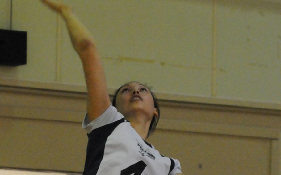 Seoul American Falcons outside hitter Hannah Swafford serves against Gushikawa Commercial High School during Sunday's international matches in the 2011 Okinawa District Volleyball Festival at Kubasaki High School, Okinawa.