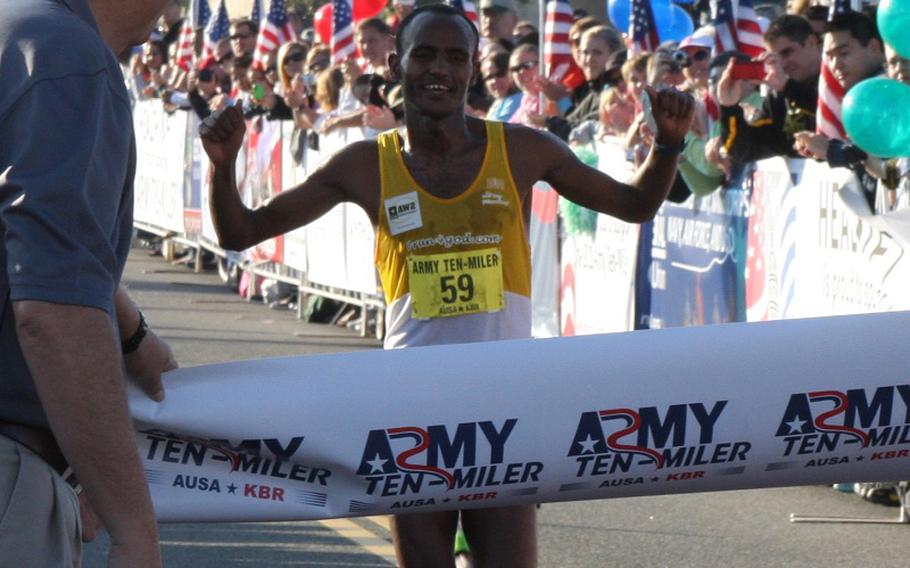 Tesfaye Alemayehu hits the finish line at the Army Ten-Miler in Washington, D.C. on Sunday. His team ran in honor of Army veteran David Wynne Francis, who recently passed away after a battle with cancer.