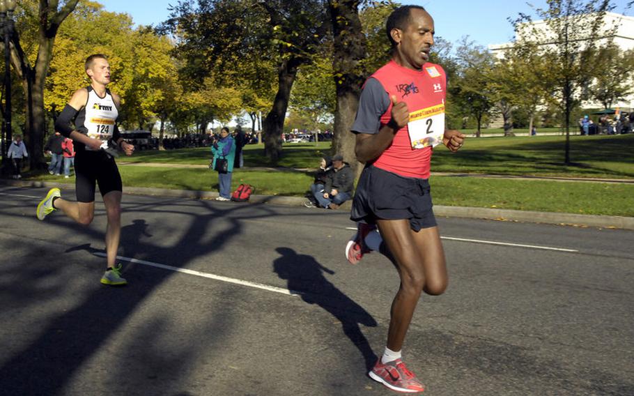 Emiru Mekonnen still holds a short lead over Chad Ware near the 16-mile mark, but Ware soon took the lead for good.