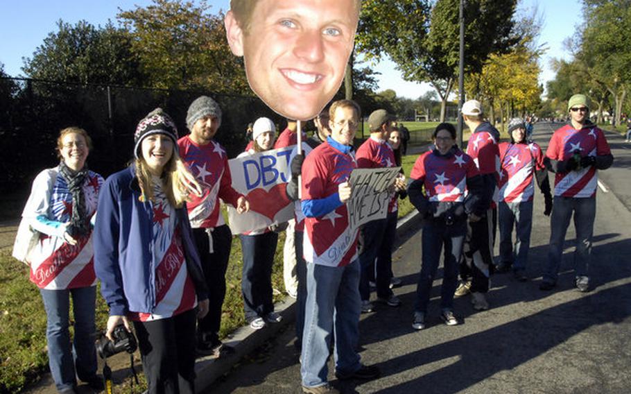 Justin Withoff's cheering section brought a super-sized image of their favorite runner to the race.