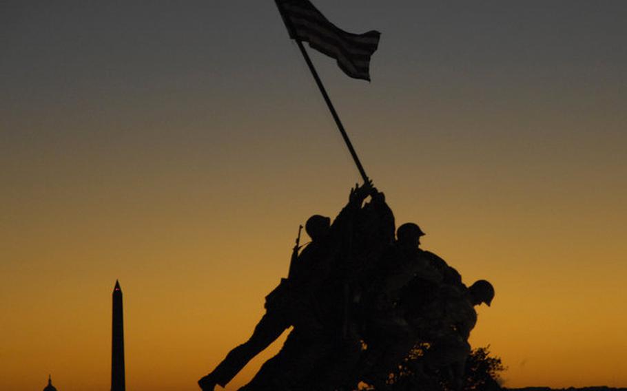 The Iwo Jima Memorial is silhouetted against the predawn sky before Sunday's Marine Corps Marathon.