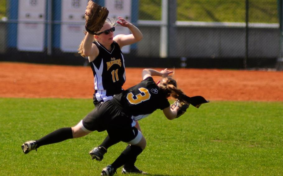 Patch's Haile Baker and Paige Miller collide as Baker catches a fly ball during the first game of a doubleheader Saturday at Patch Barracks.