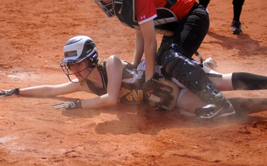 Patch's Shannon Wright slides into home as Schweinfurt's Katherine Street tries to tag her out during the first game of a doubleheader Saturday at Patch Barracks.